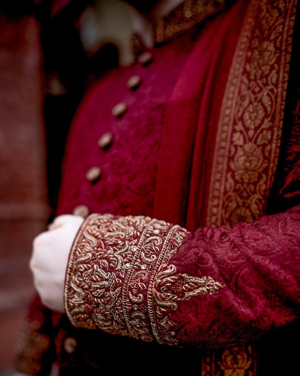 Detail of the groom's embroidered maroon sherwani cuff and dupatta border, Adam & Sobia's wedding at Chamba House, Lahore