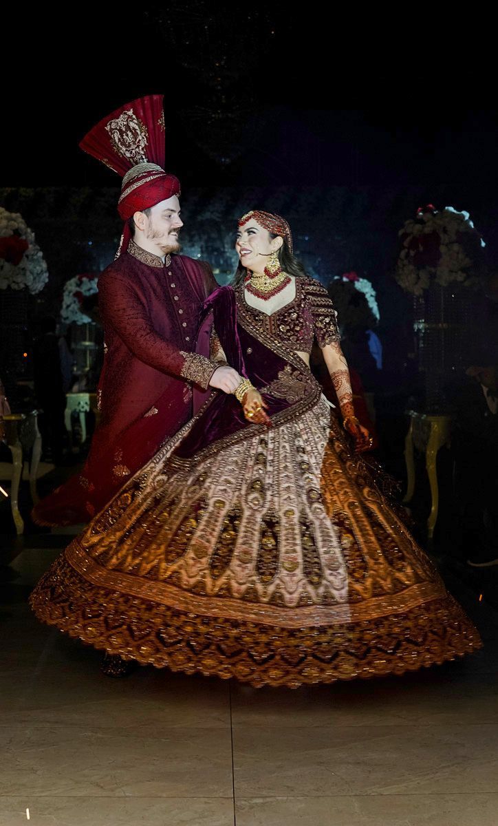 Bride's lehenga flaring out as she and the groom dance together at the reception, Adam & Sobia's wedding