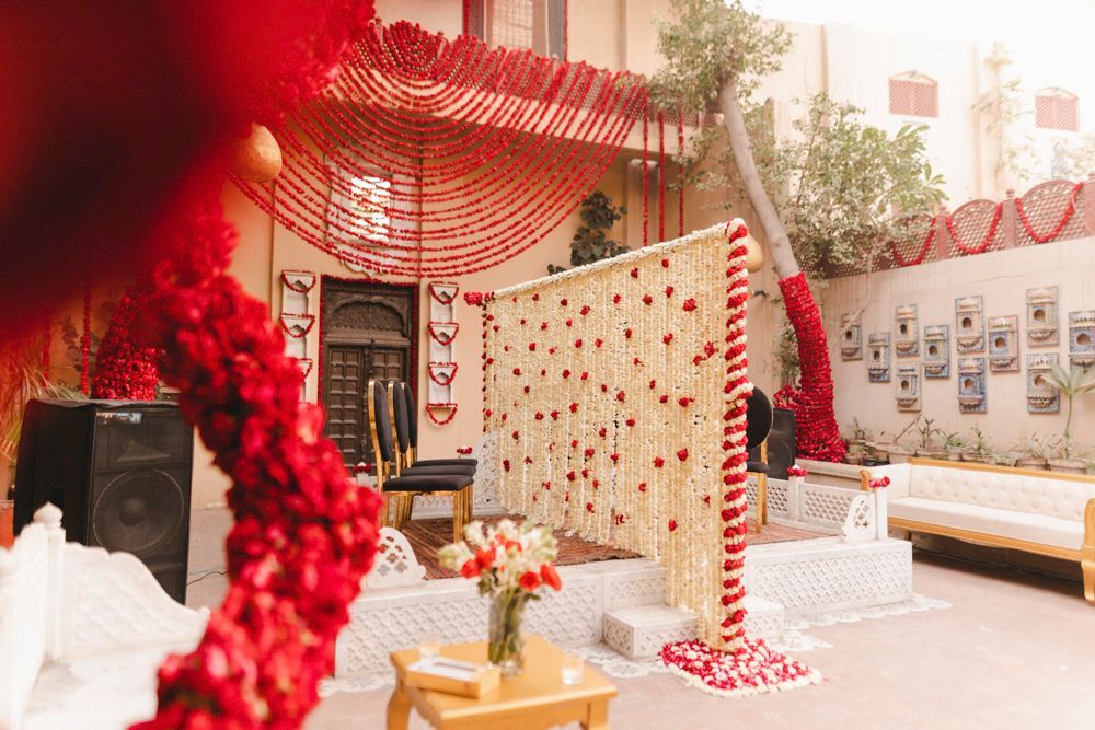 Detail of the marigold and rose garland curtain set up for the nikah ceremony, Ahmed & Laraib's wedding at Barood Khana Haveli, Lahore