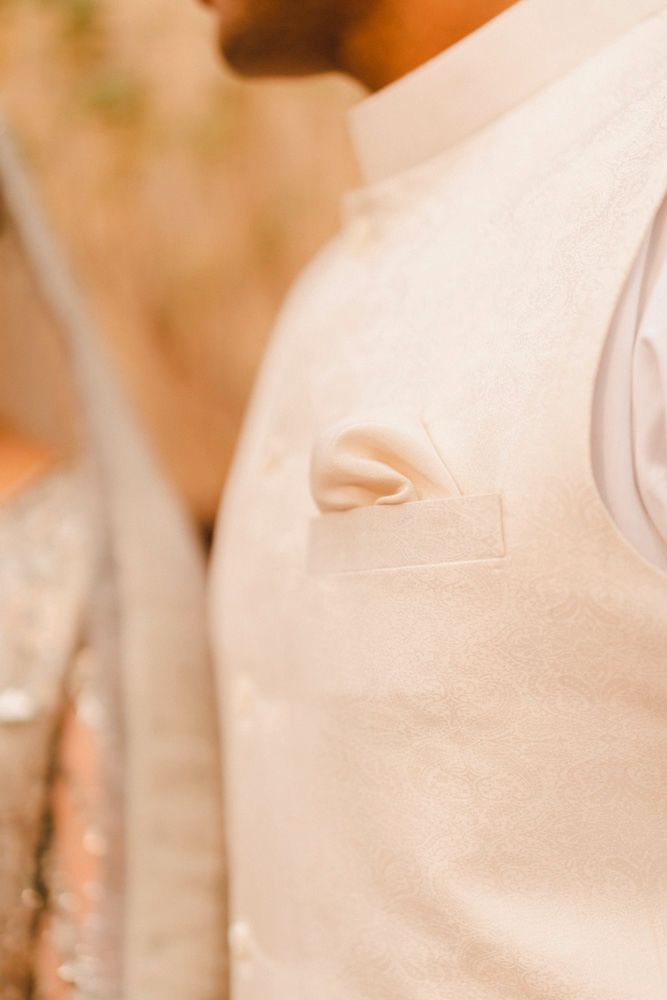 Detail of the groom's cream waistcoat and pocket square, Ahmed & Laraib's wedding