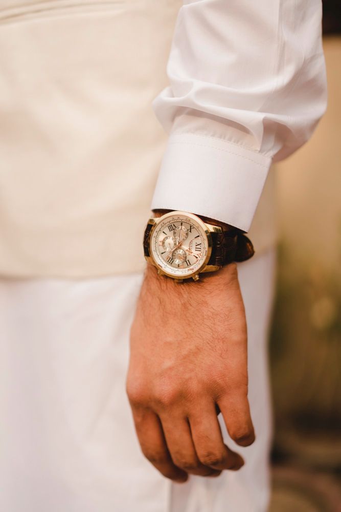 Detail of the groom's wristwatch and white sherwani sleeve, Ahmed & Laraib's wedding