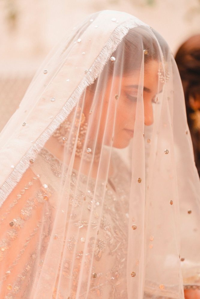 Close-up of the bride beneath her sequined veil during the nikah ceremony, Ahmed & Laraib's wedding