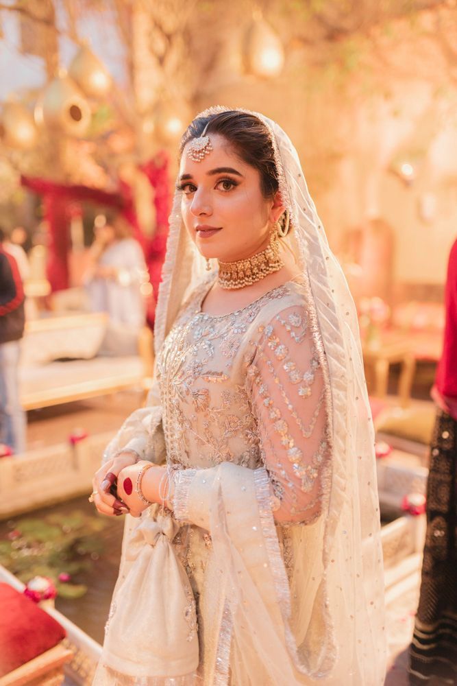 Solo bridal portrait in the haveli courtyard at golden hour, Ahmed & Laraib's wedding