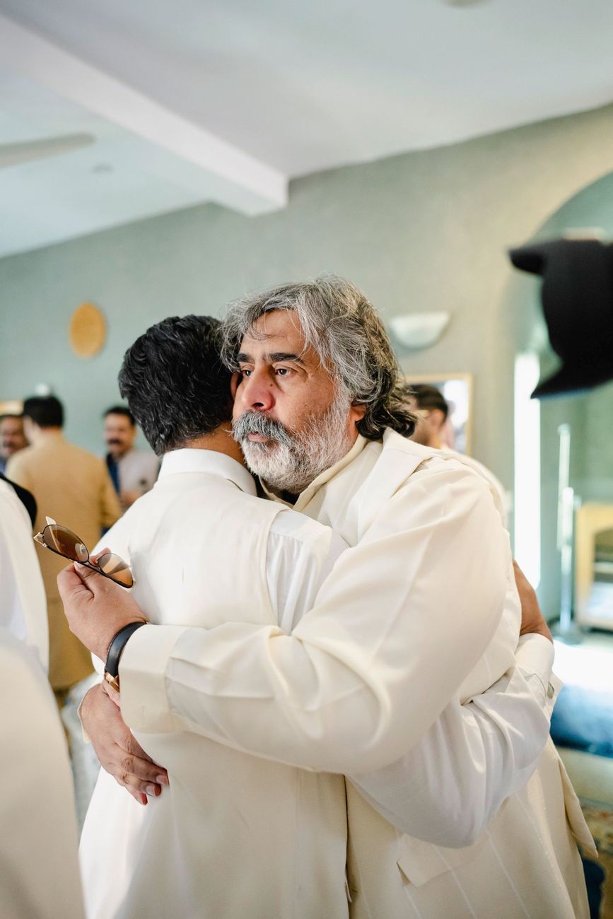Emotional embrace between the groom and an older family member after the nikah, Maham & Aurangzeb's wedding