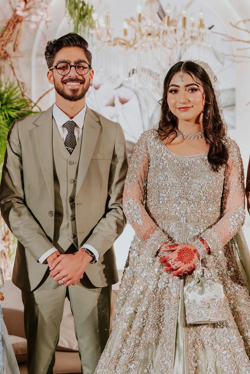 Close-up portrait of bride and groom smiling together at the walima reception, Maham & Aurangzeb's wedding