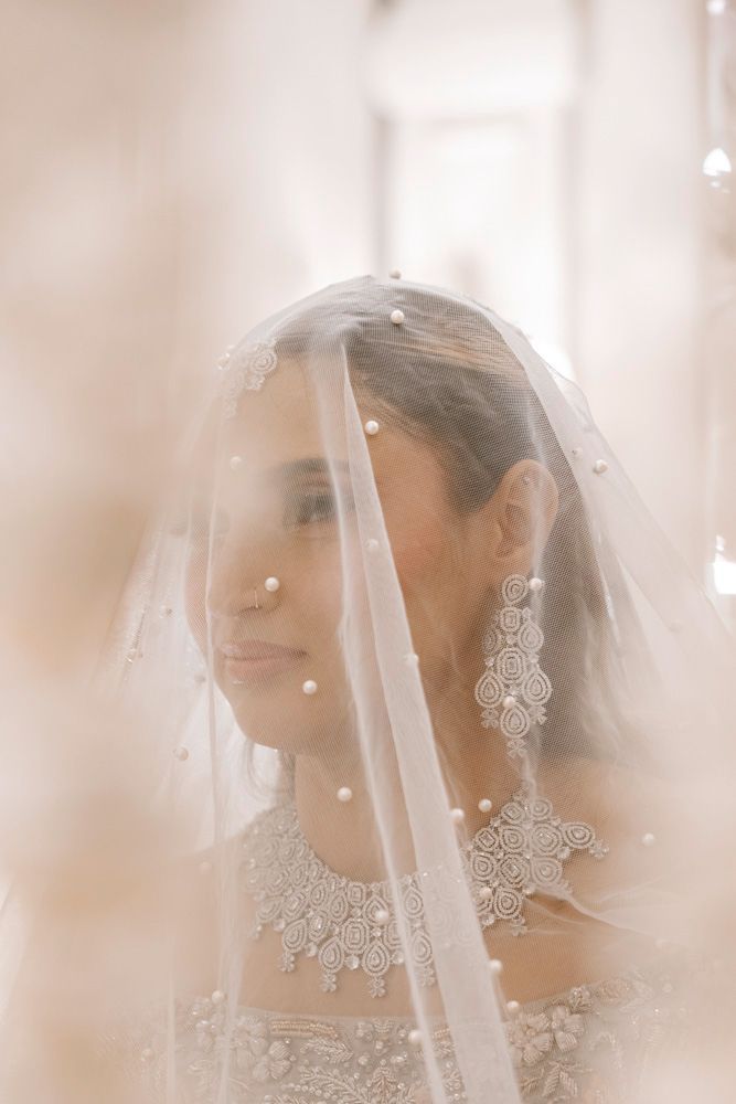 Close-up of the bride beneath her veil during the nikah ceremony, Sheraz & Nawal's wedding at Nishat Hotel, Lahore