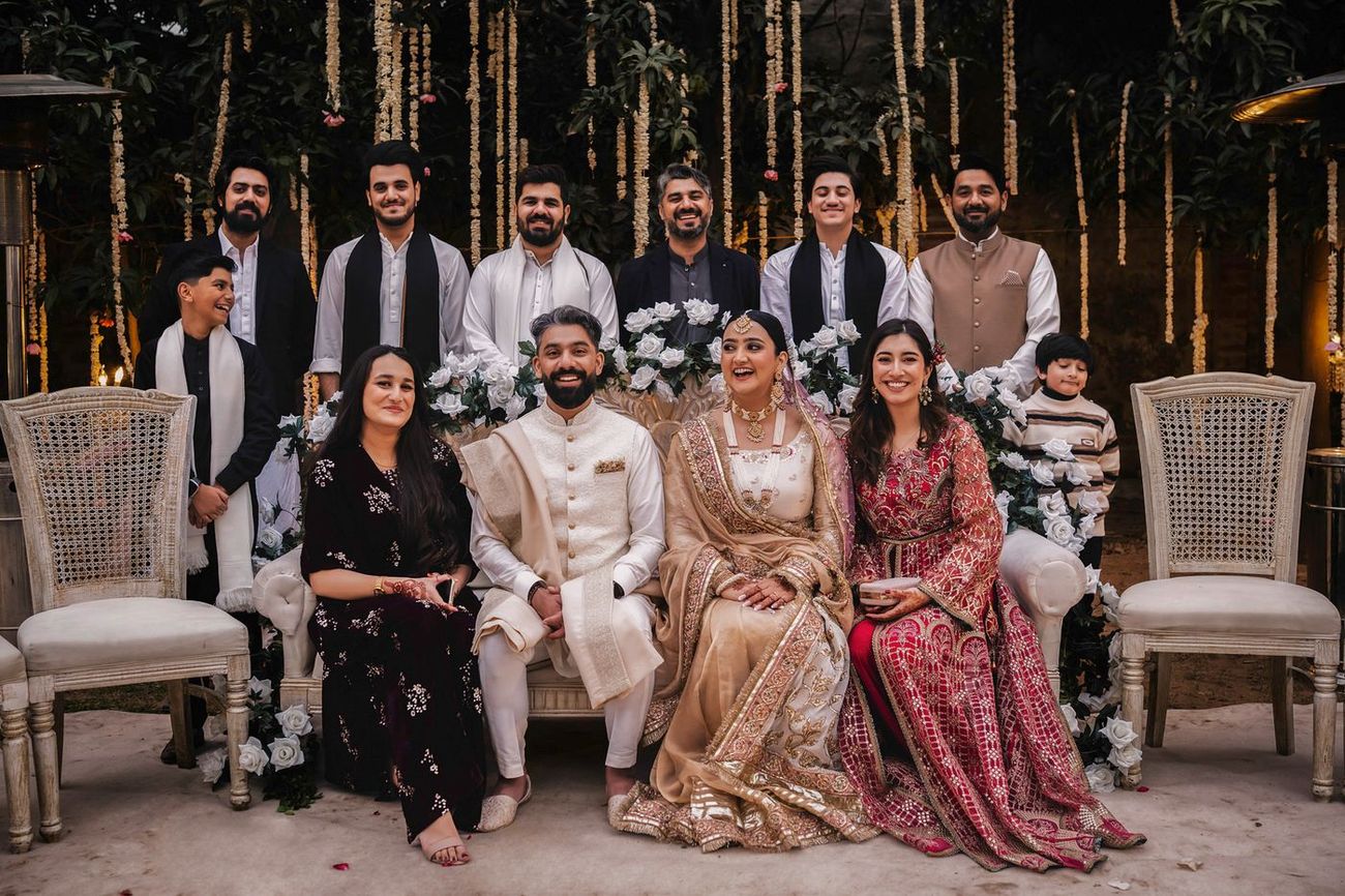 Group photo with younger cousins and siblings, couple seated centrally