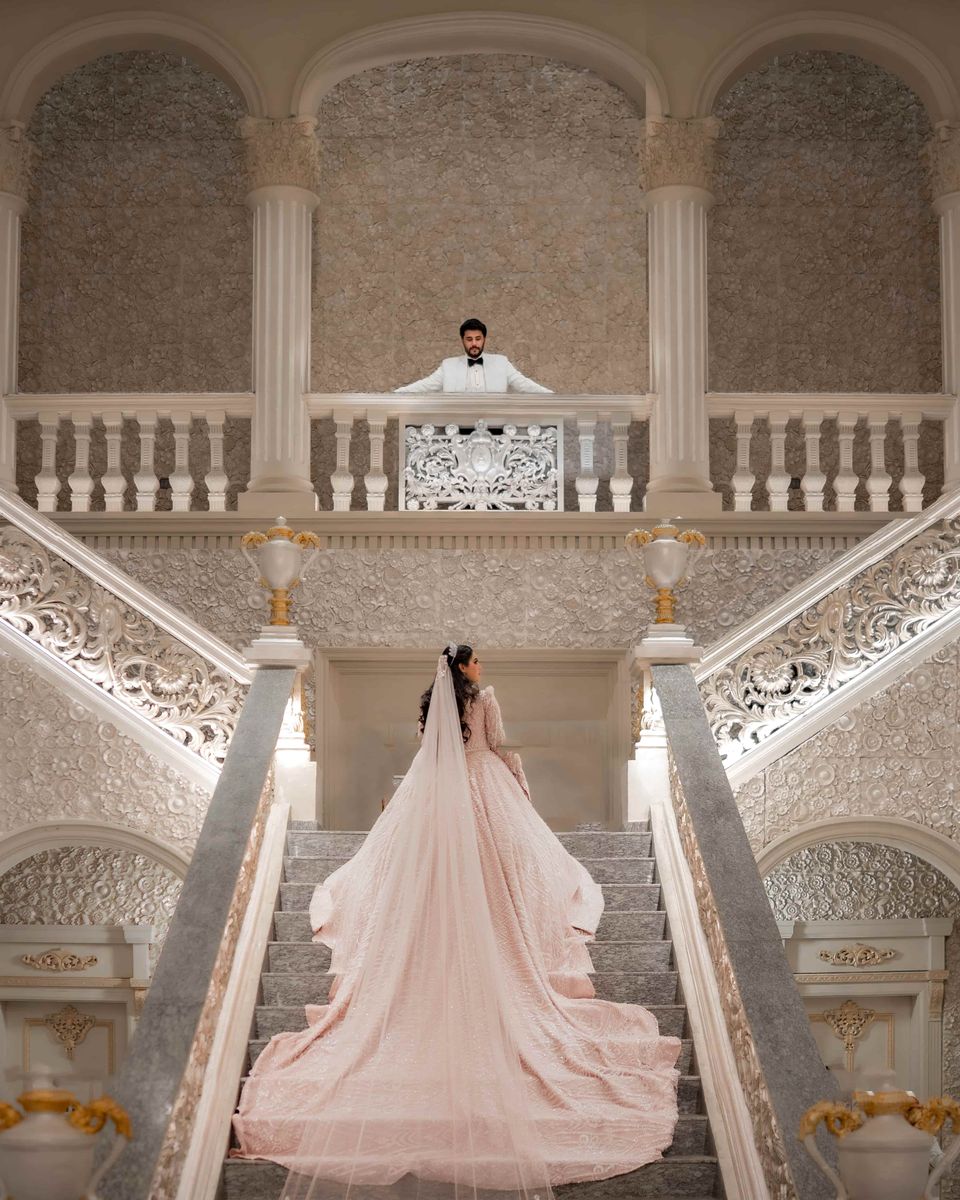 Luxury wedding portrait on a grand staircase
